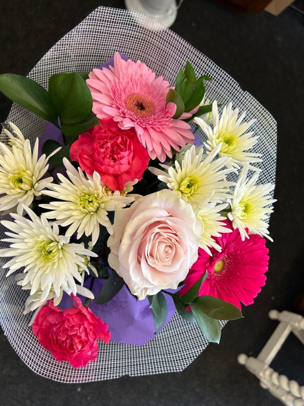 Flowers in lilac cellophane sleeve